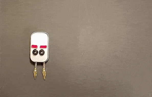 Animation made with common household objects of two characters approaching, looking down at six feet caption, and stepping back